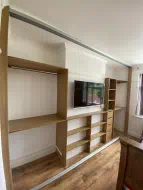Lancaster Oak interior providing conventional hanging in alcoves and utilising shallow shelving to accommodate a chimney breast, fitted in Acklam